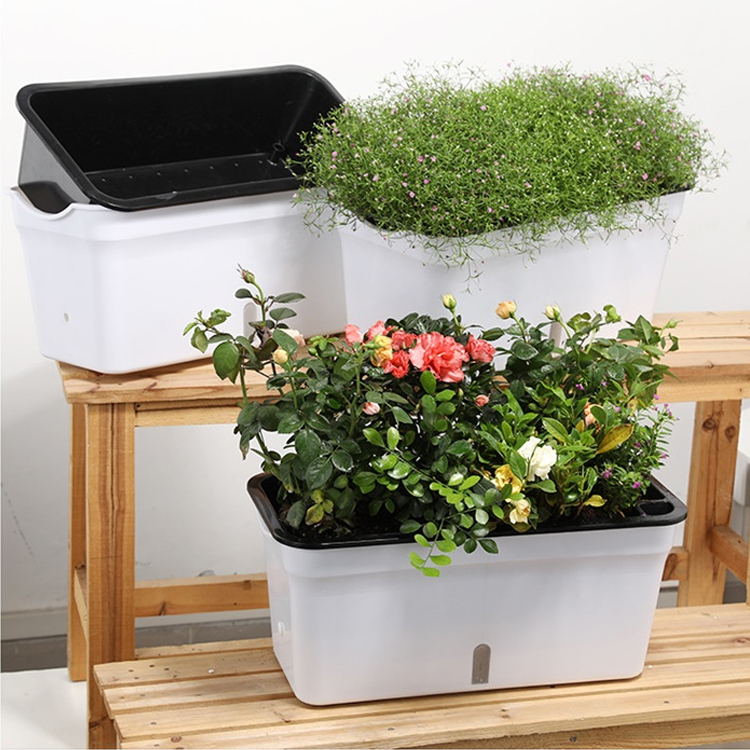 Recipientes plásticos das camas da bacia da caixa do plantador da planta da flor vegetal